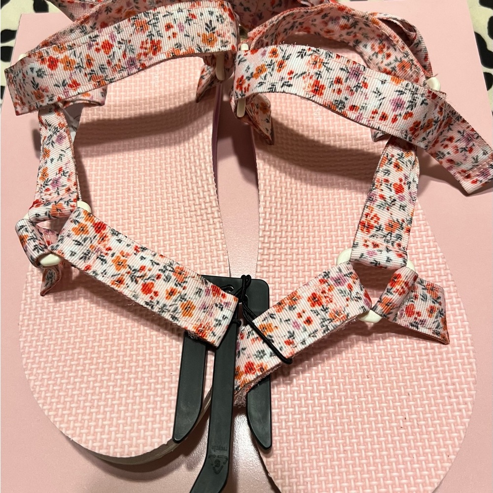 Sandals with velcro fastener.